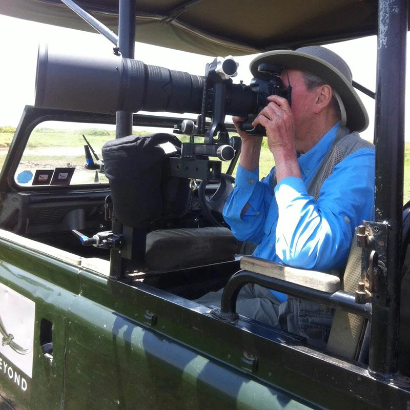 Dr. Stanley on a photographic trip in Africa.