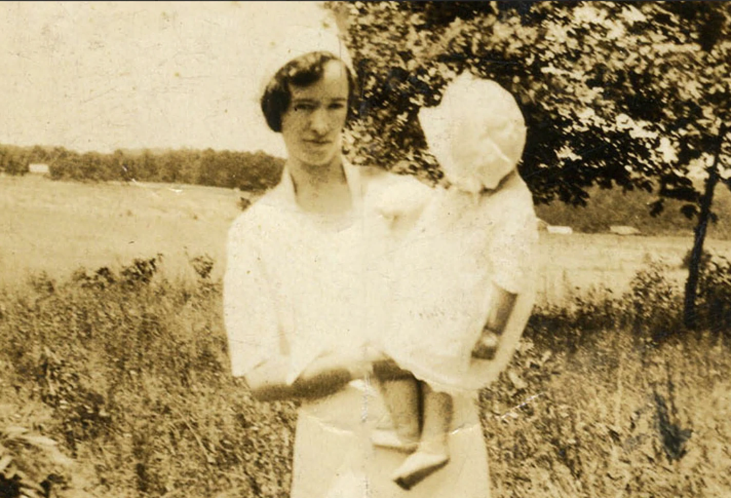 Rebecca holds baby Charles in this photo circa 1933.